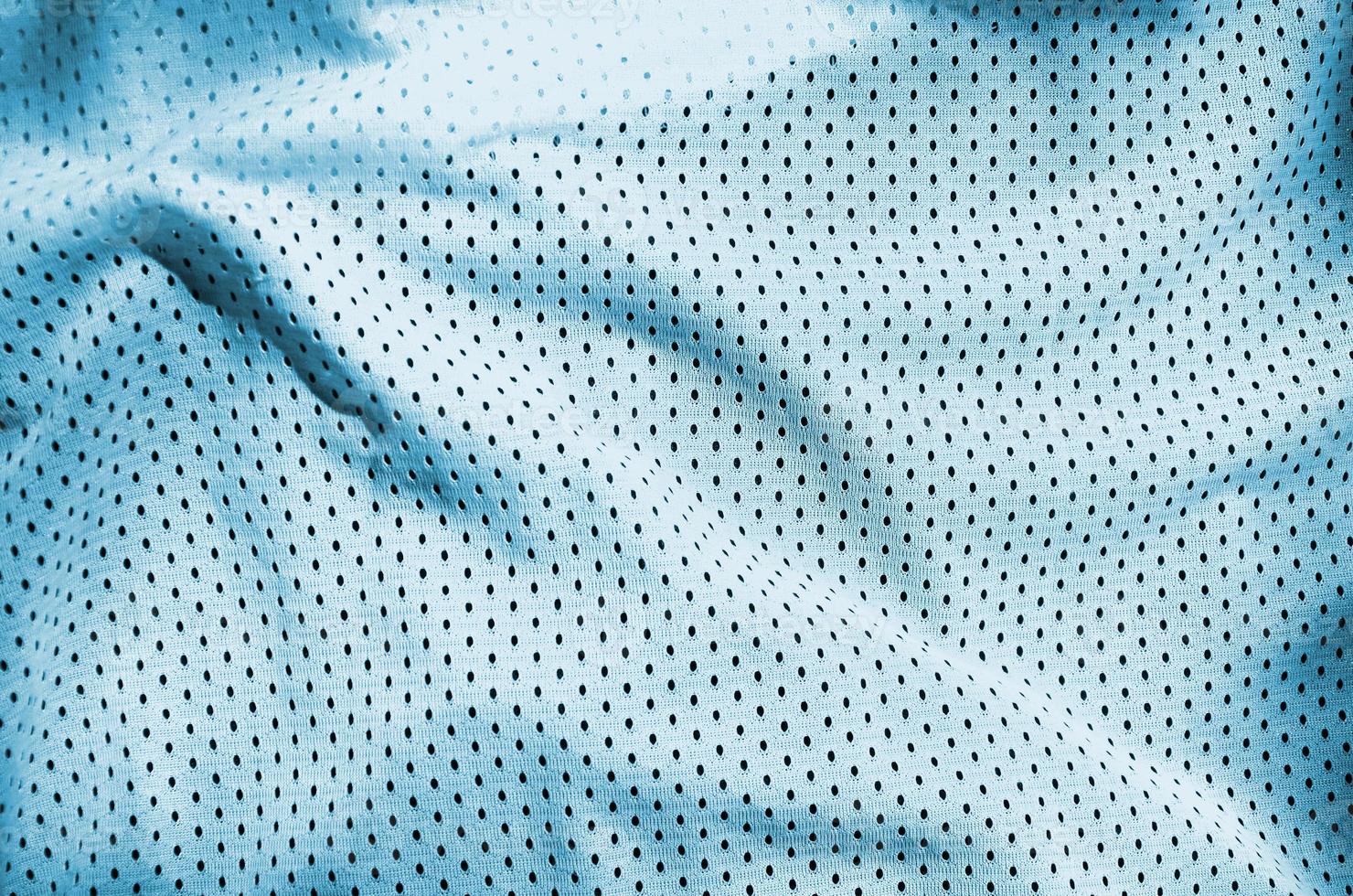 Close up of light blue polyester nylon sportswear shorts to created a textured background photo