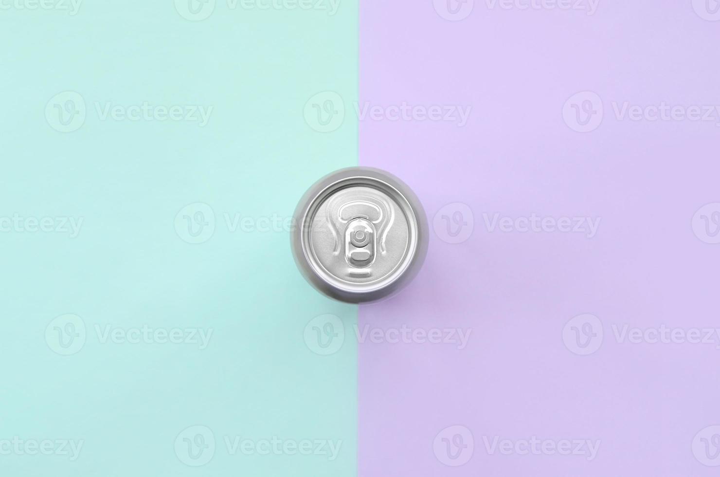 Metallic beer can on texture background of fashion pastel violet and blue colors paper in minimal concept photo