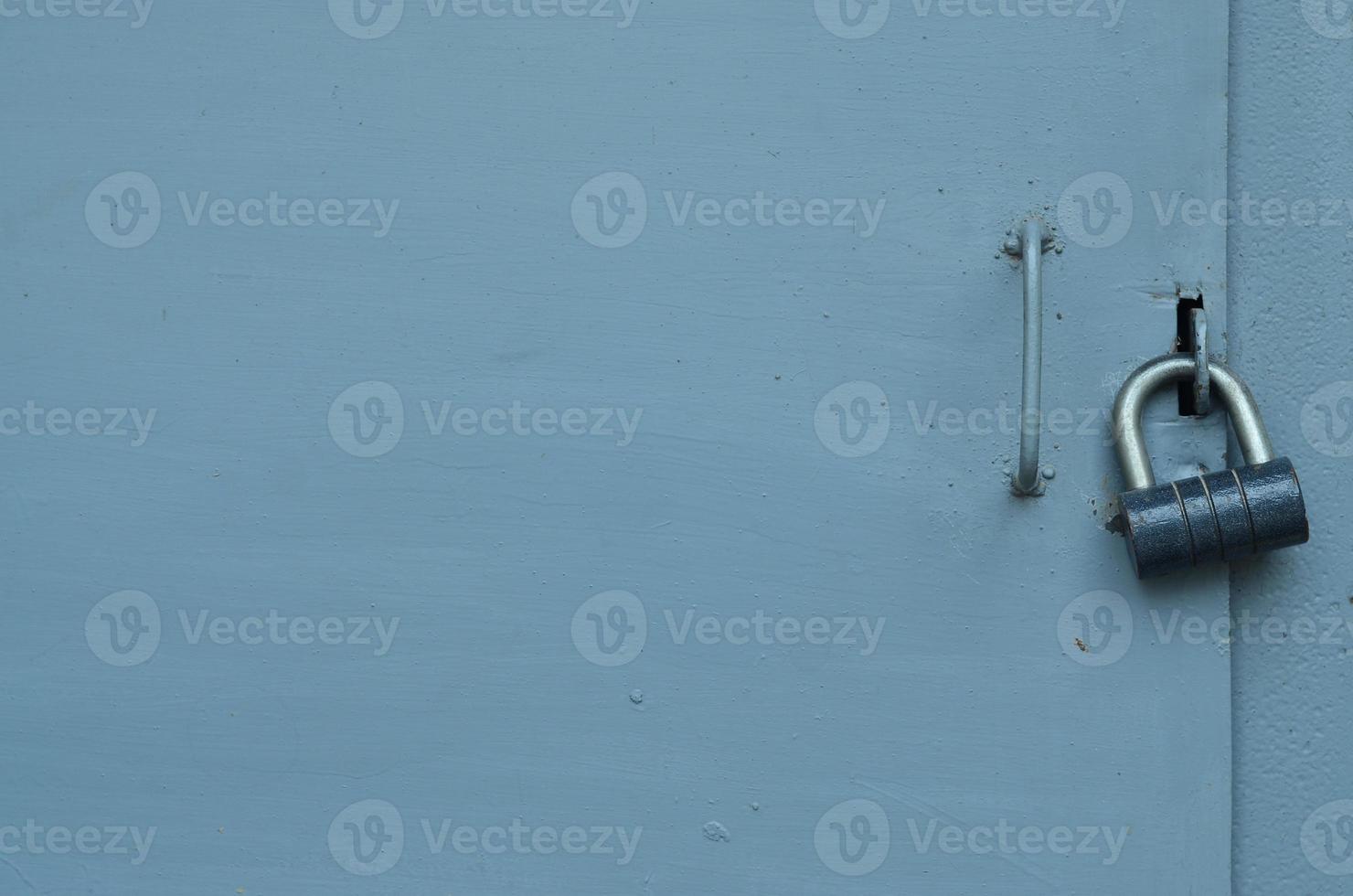 Metal surface from the outer old door with a lock photo