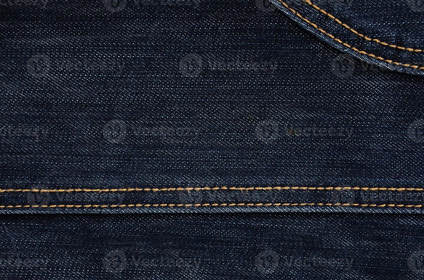 The texture of black denim cloth photo