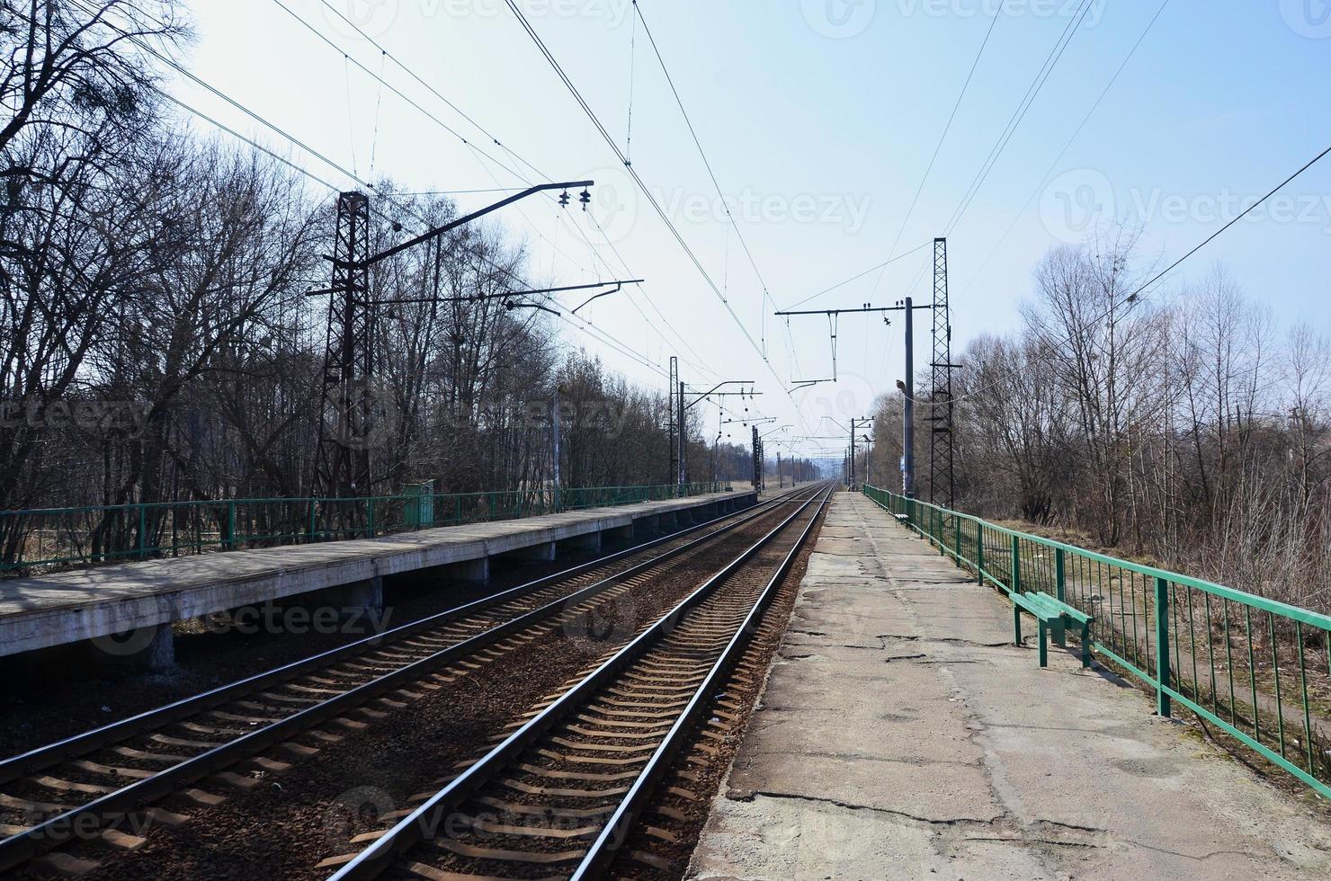 A railway station with platforms for waiting for trains photo