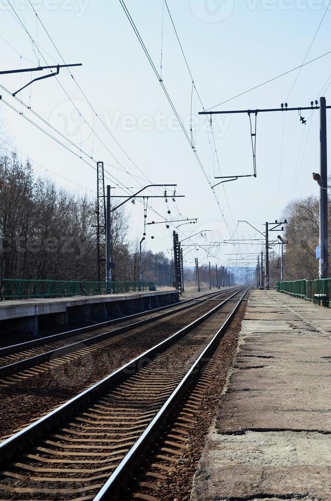 A railway station with platforms for waiting for trains photo