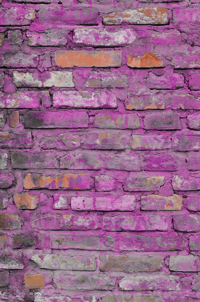 Weathered and stained old brick wall texture photo