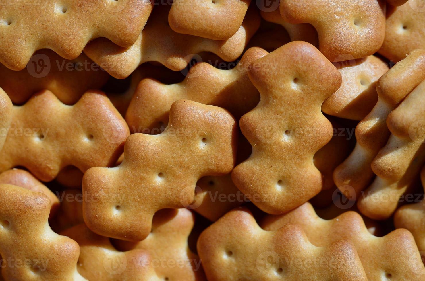 Macro photography of a many yellow salted cracker photo