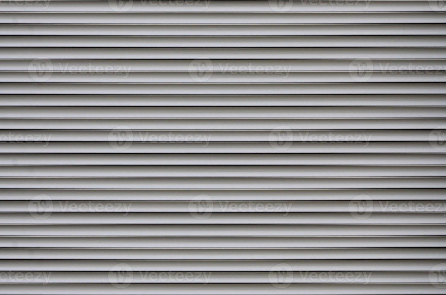 The texture of the shutter door or window in light gray color photo