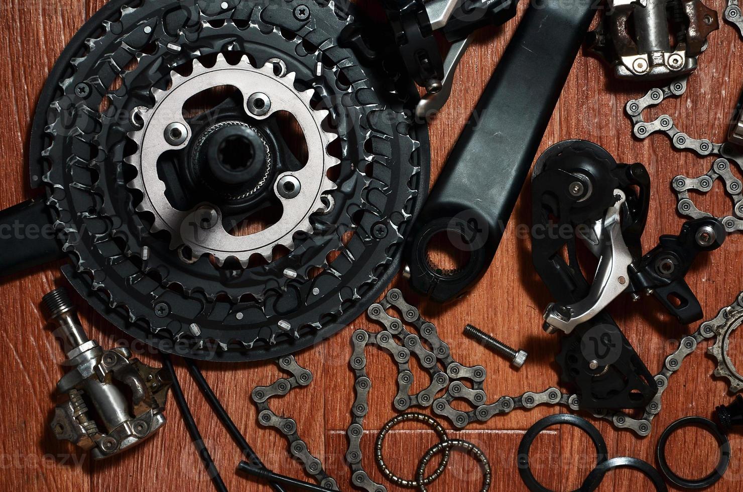Many different metal parts and components of the running gear of a sports bike photo