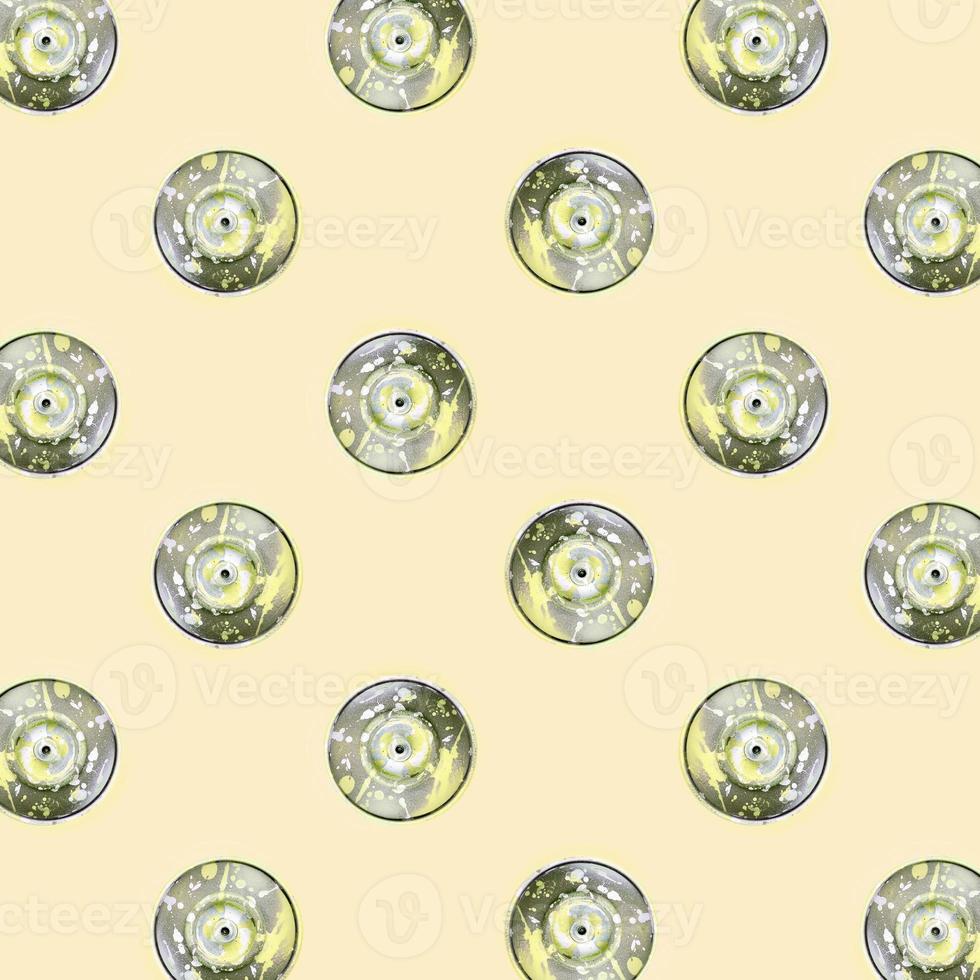 Many used spray cans for graffiti drawing lies on a pastel colored backgroung. Street art painting concept. Minimal flat lay pattern. Top view photo