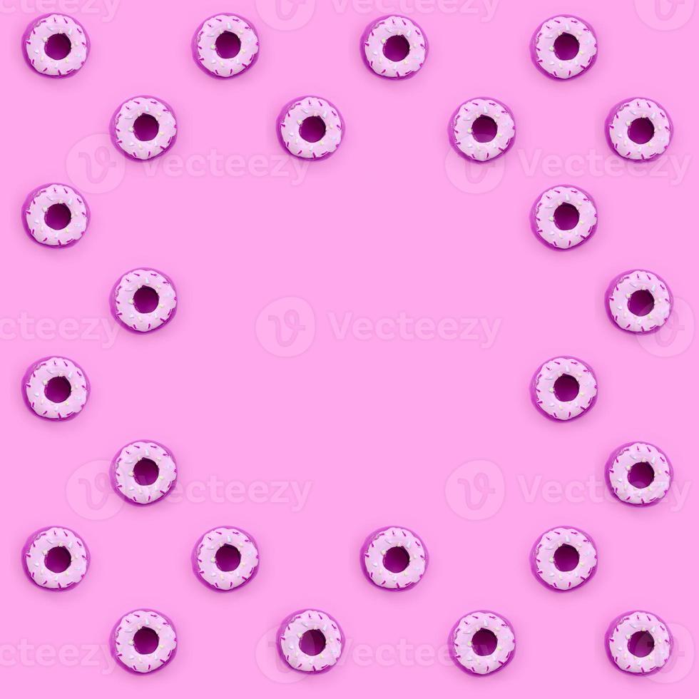 Many small plastic donuts lies on a pastel colorful background. Flat lay minimal pattern. Top view photo