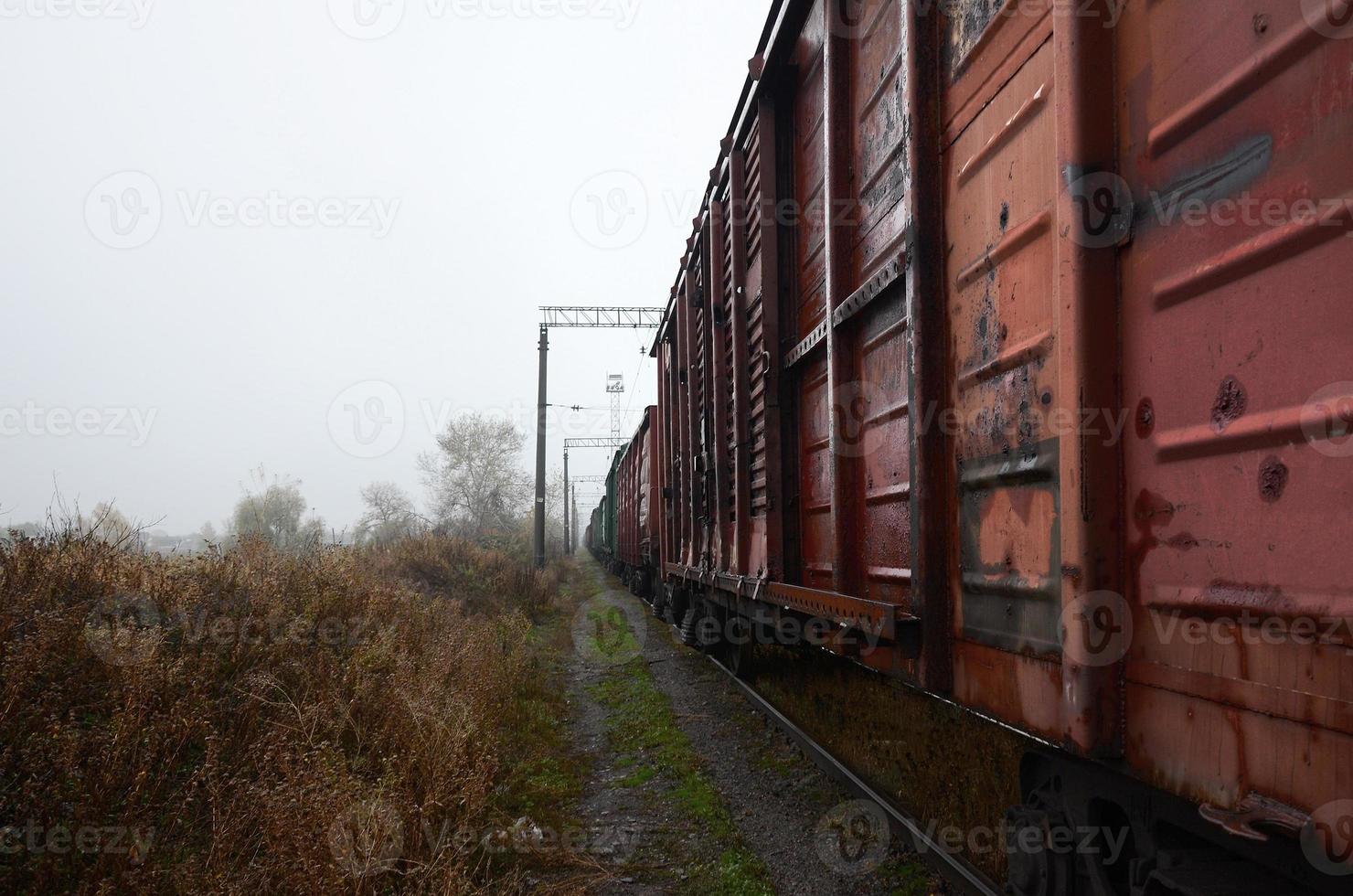 Photo of the train on rainy cloudy weather with shallow depth of field