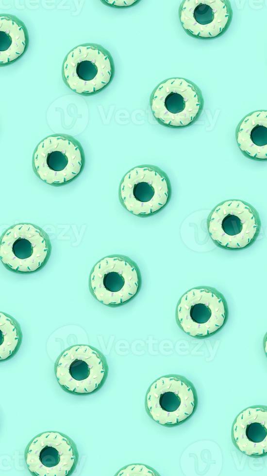 Many small plastic donuts lies on a pastel colorful background. Flat lay minimal pattern. Top view photo
