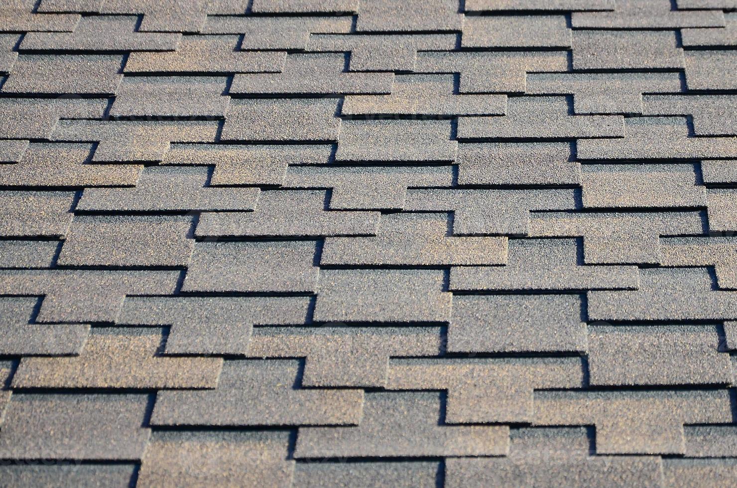 Modern roofing and decoration of chimneys. Flexible bitumen or slate shingles photo