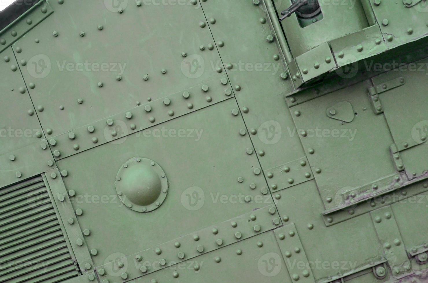 Abstract green industrial metal textured background with rivets and bolts photo
