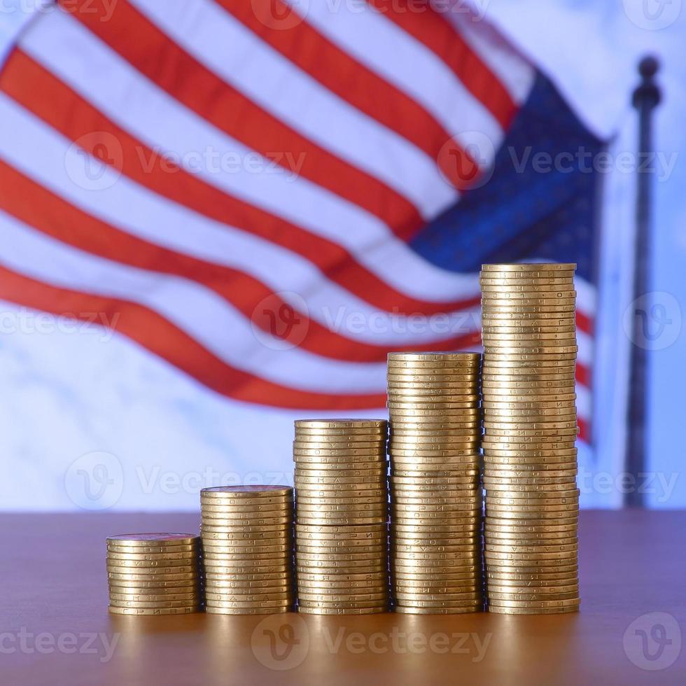 Golden coin stacks arranged as a graph. Increasing columns of coins photo