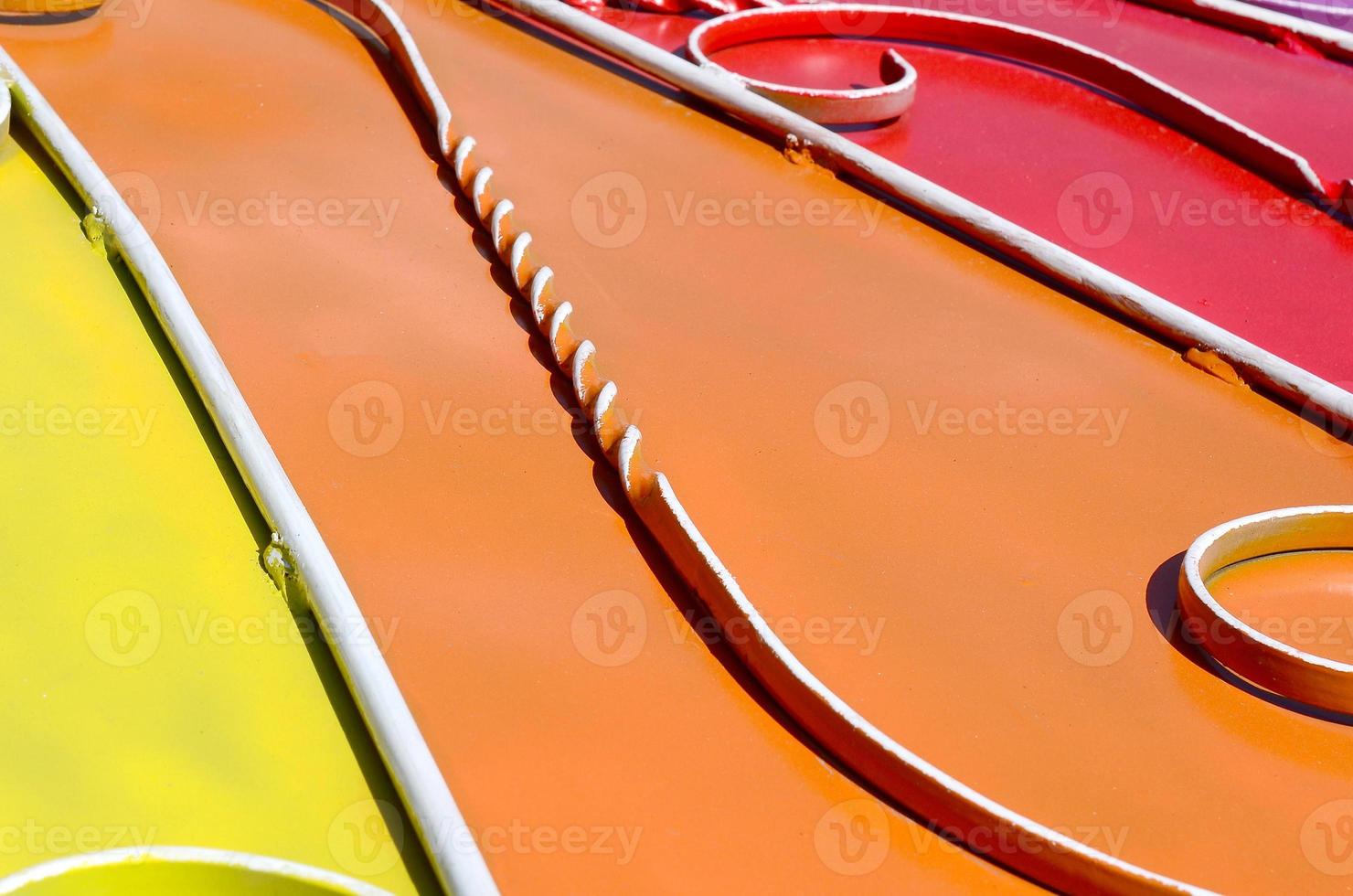 Metal texture of a piece of colored wall with a forged pattern photo