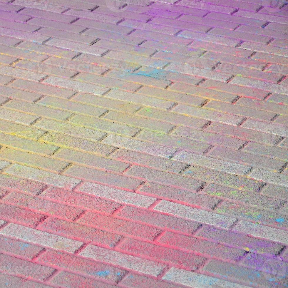 Multi colored paving slabs, powder coated with dry colors at the Holi