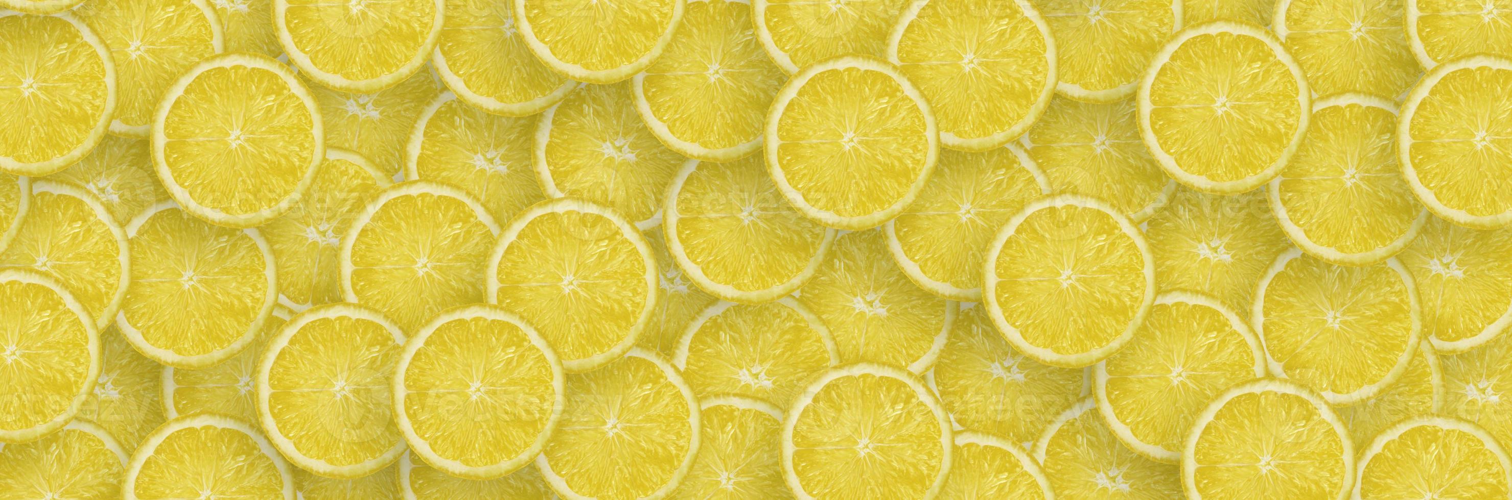 Pattern of yellow lemon citrus slices. Citrus flat lay photo