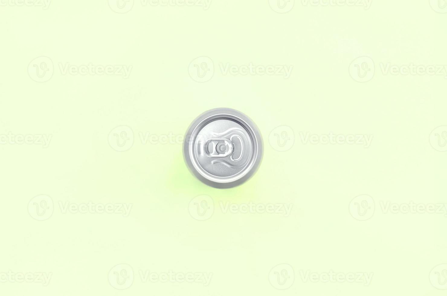 Metallic beer can on texture background of fashion pastel lime color paper photo