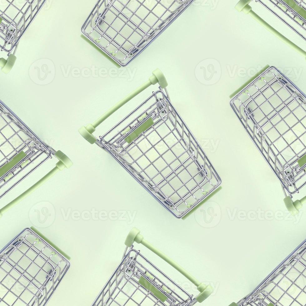 Pattern of many small shopping carts on a lime background photo