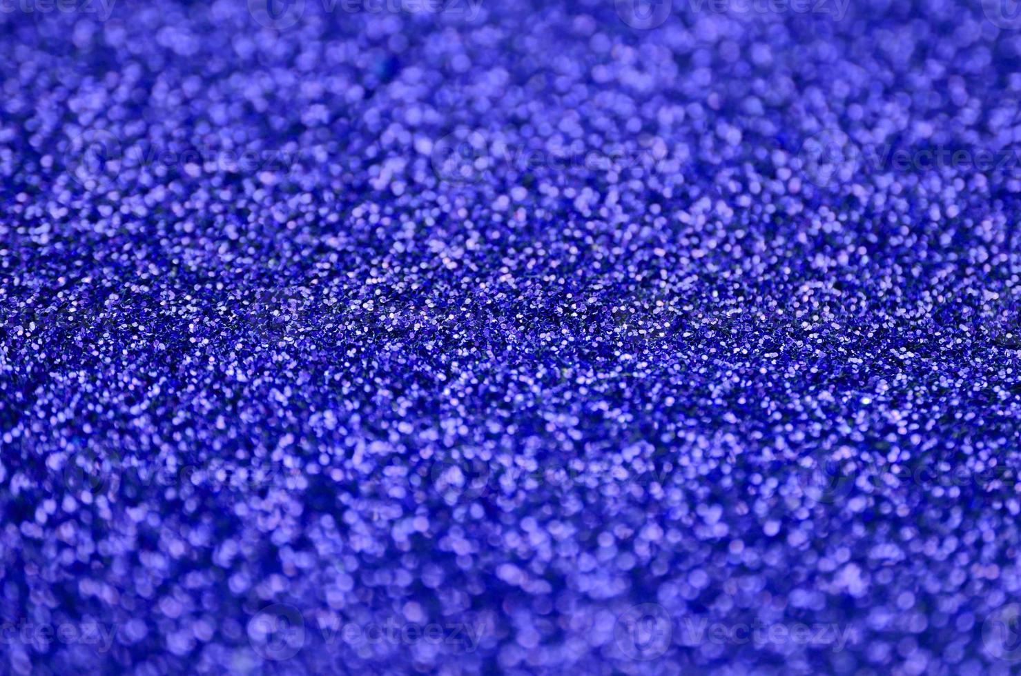 lentejuelas decorativas azules. imagen de fondo con luces bokeh brillantes de elementos pequeños foto
