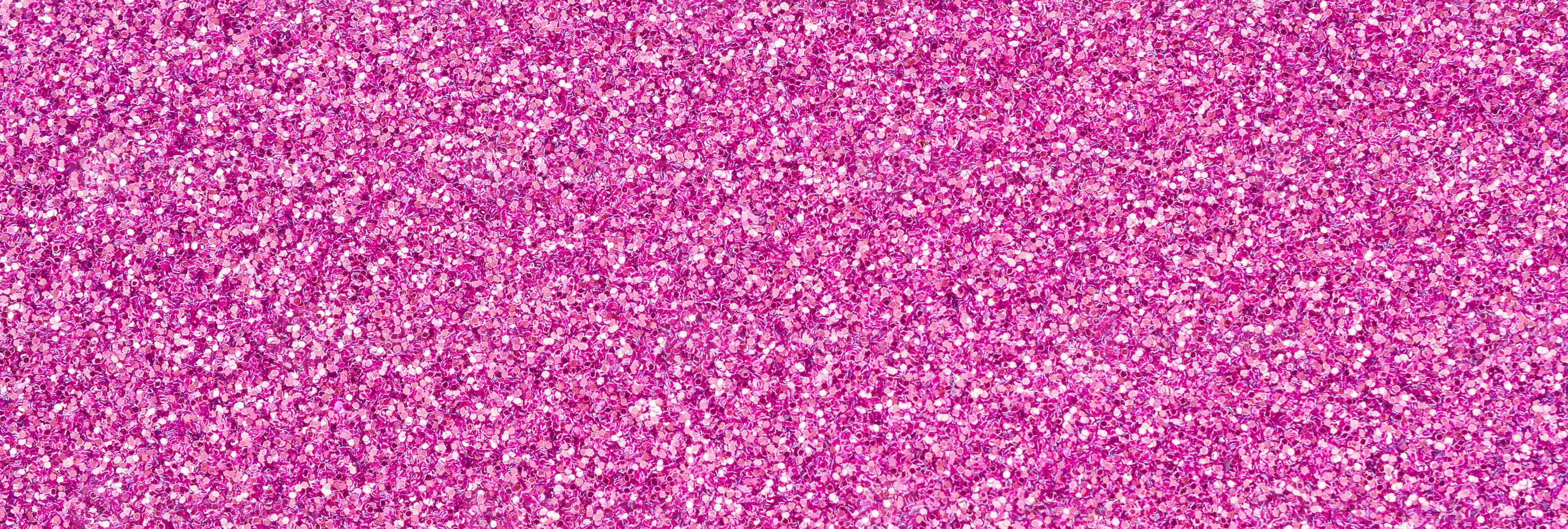 Pink decorative sequins. Background image with shiny bokeh lights from small elements photo