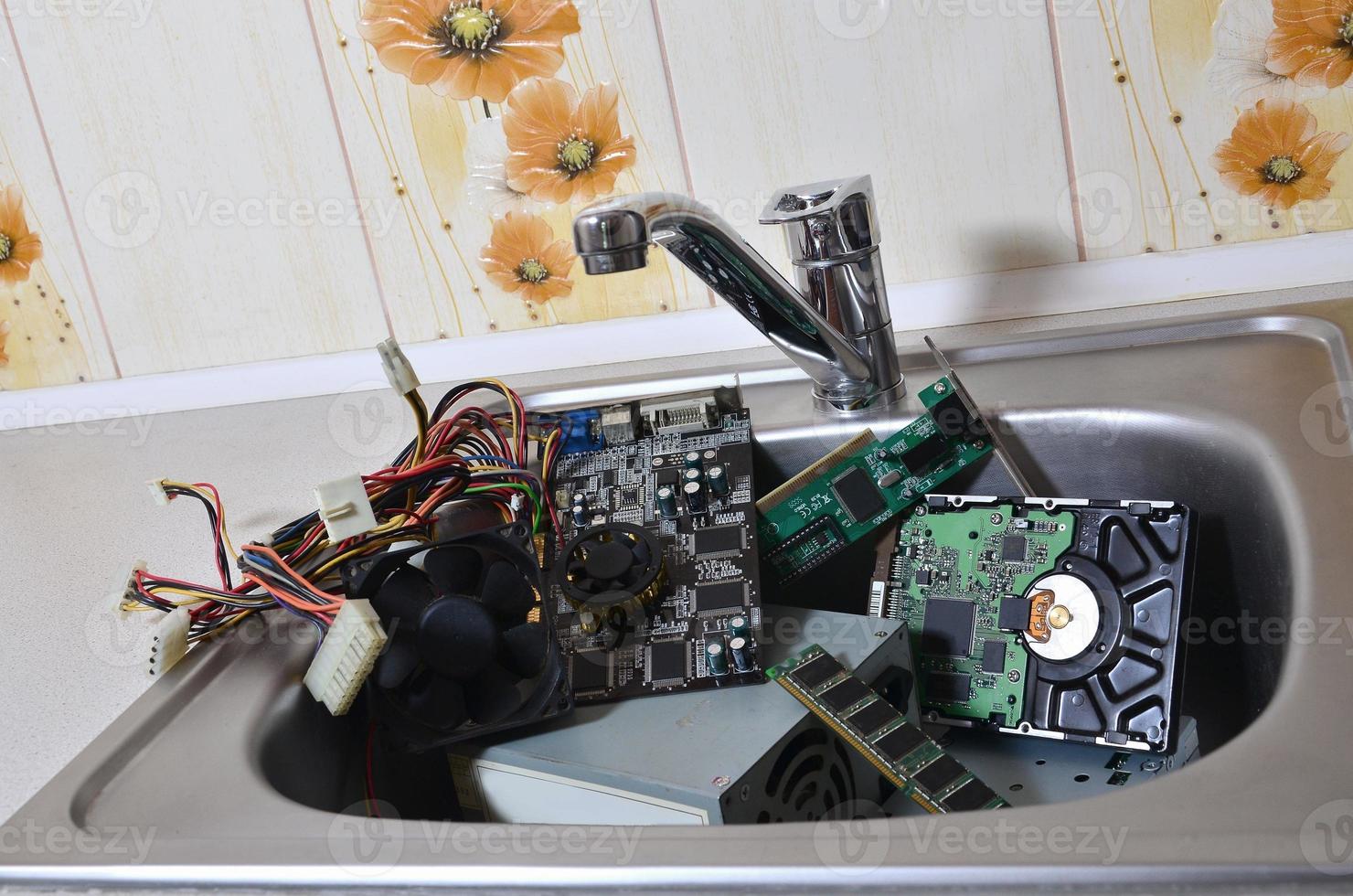 Hardware in kitchen sink computer cleaning metaphoric concept photo