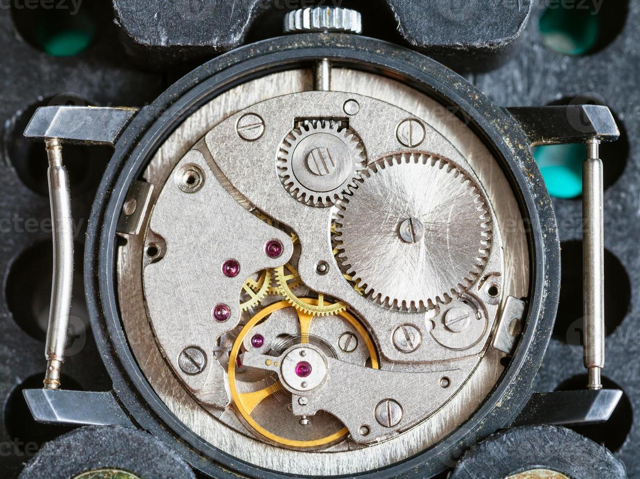 used watch fixed in plastic holder for repairing photo