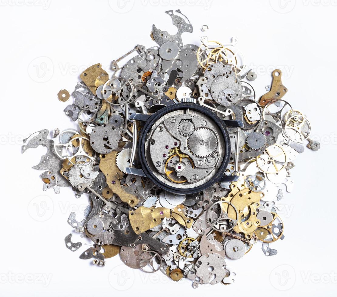 top view of mechanic watch on pile of spare parts photo