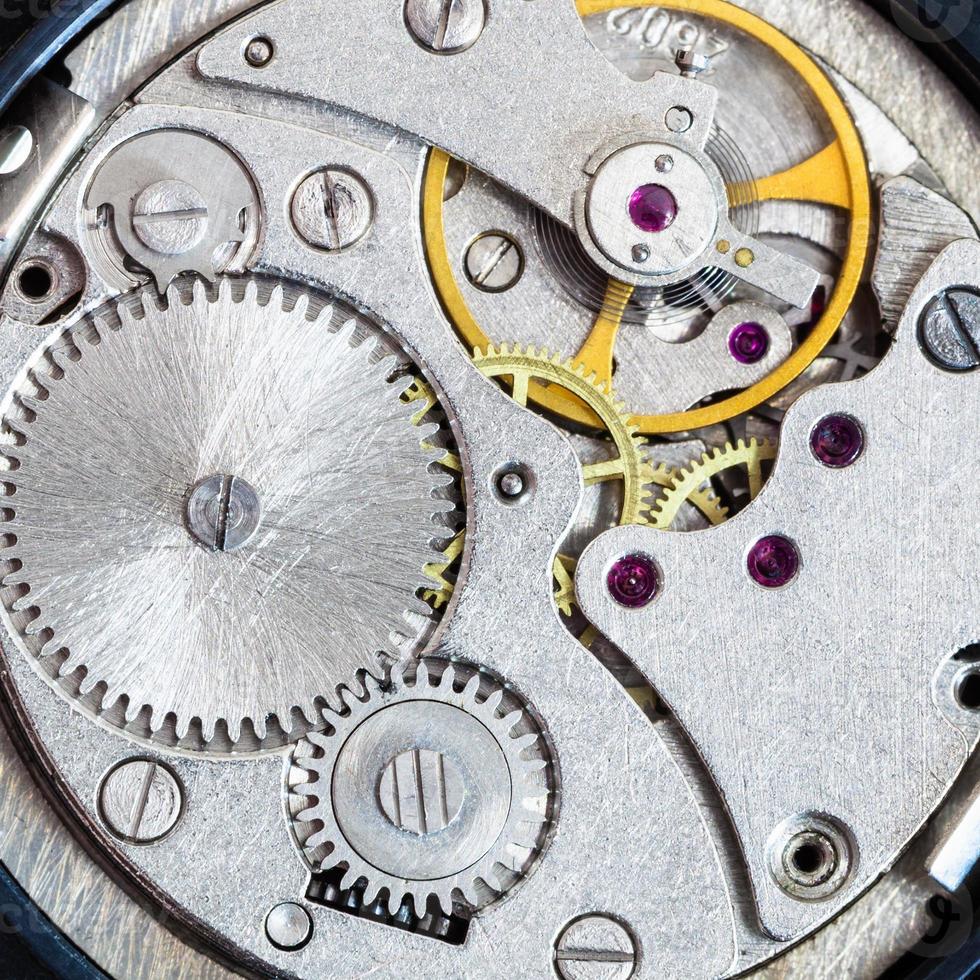 steel clockwork of old mechanical wristwatch photo