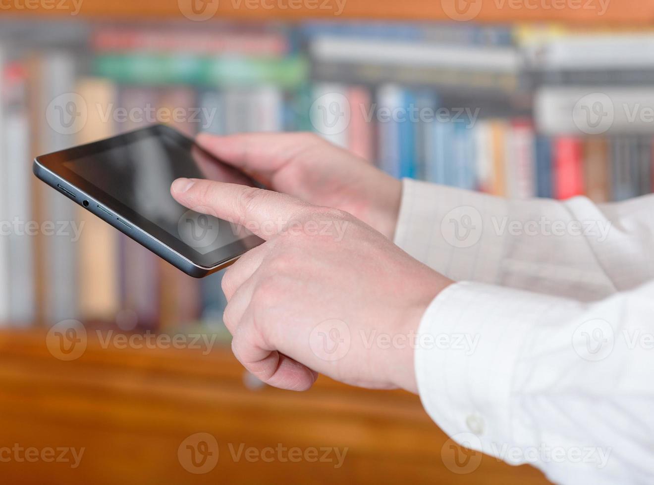 businessman finger pressing tablet pc screen photo