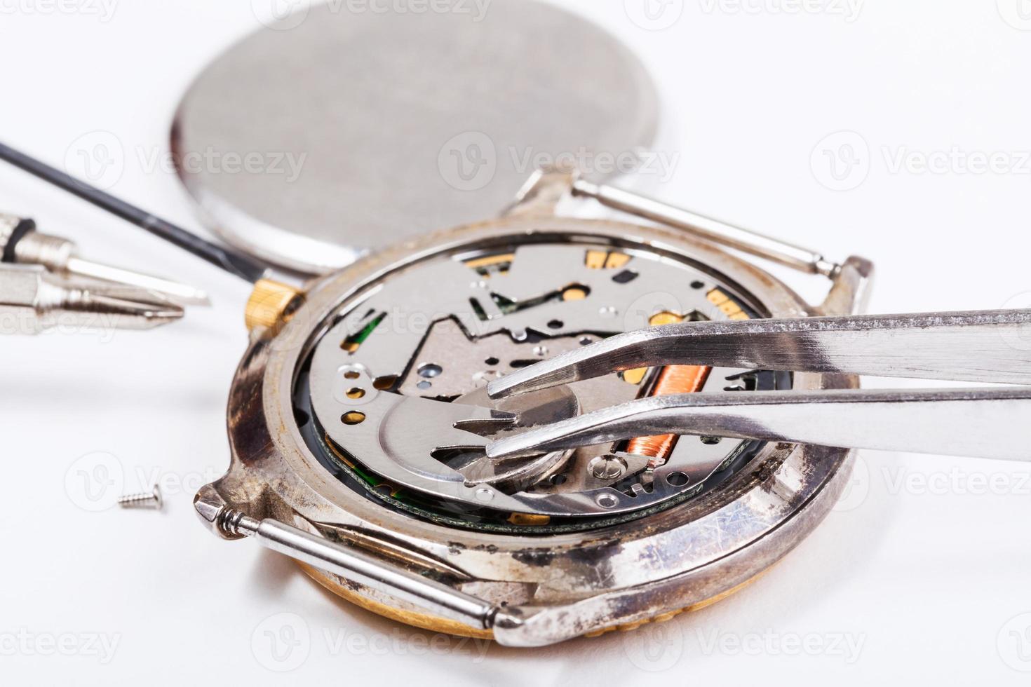 replacing battery in quartz watch close up photo