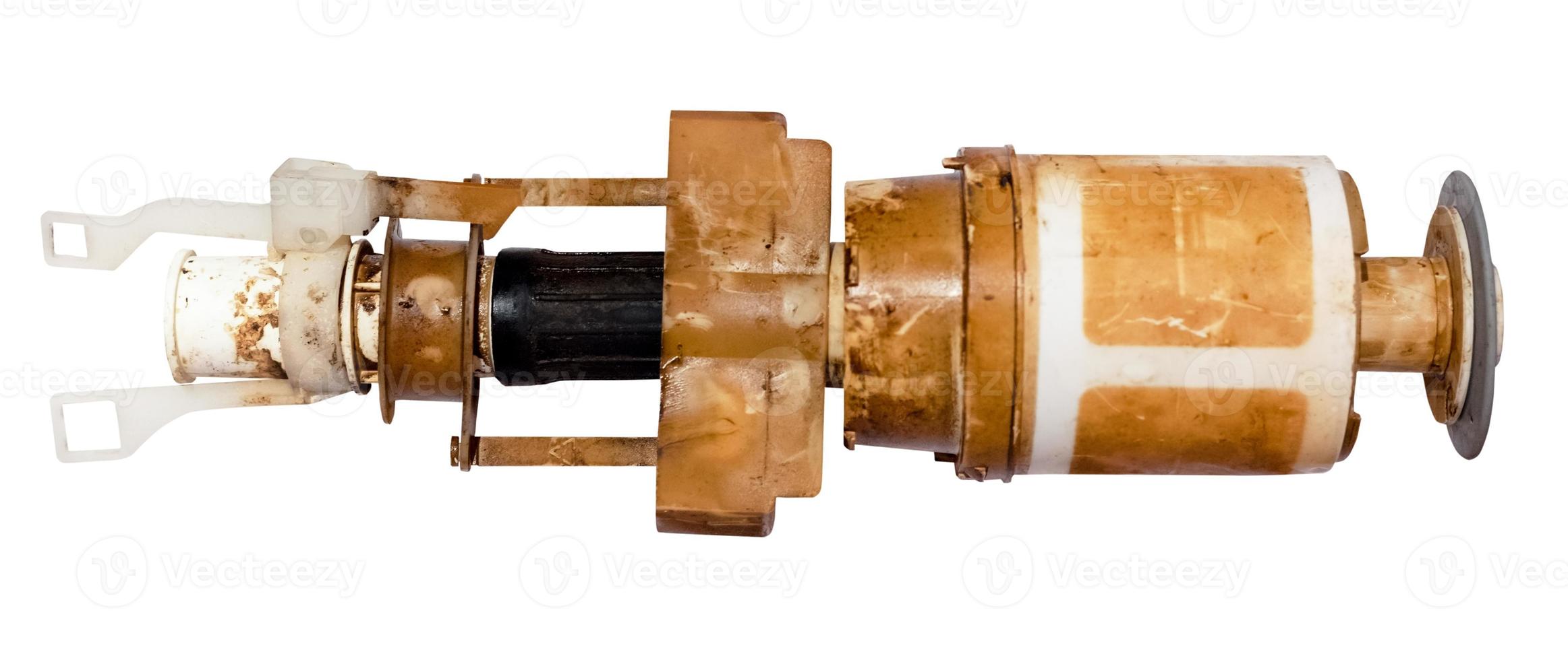 broken used flush valve of toilet cistern isolated photo