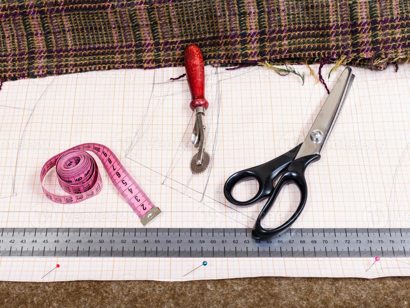 cutting table with material, pattern, tailor tools photo