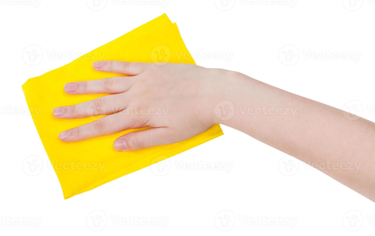 hand with yellow cleaning rag isolated on white photo