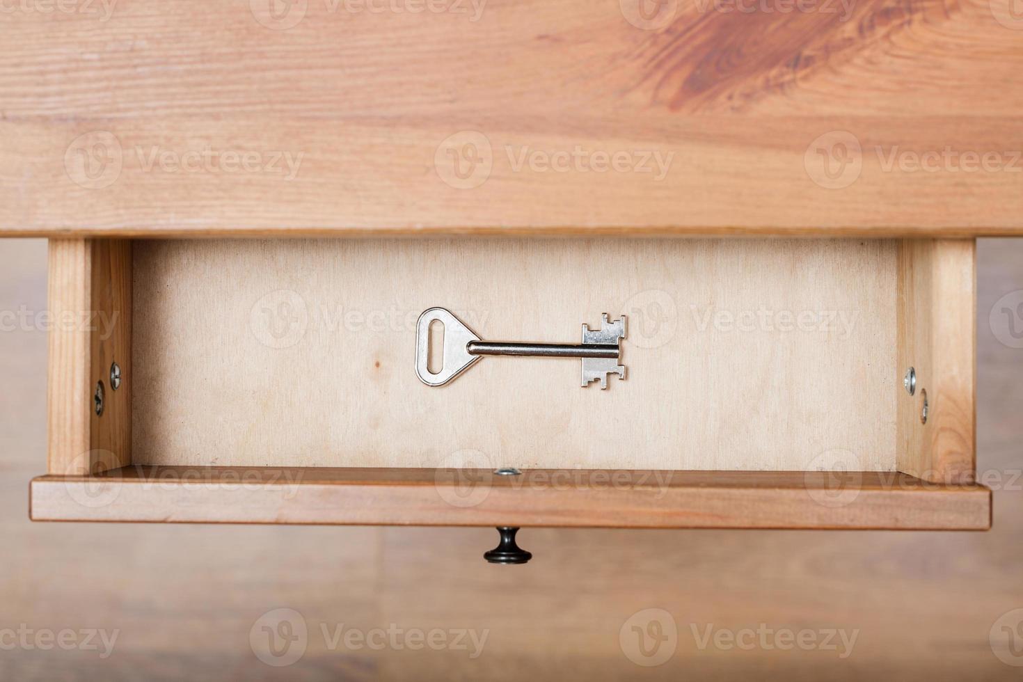 one safe key in open drawer photo