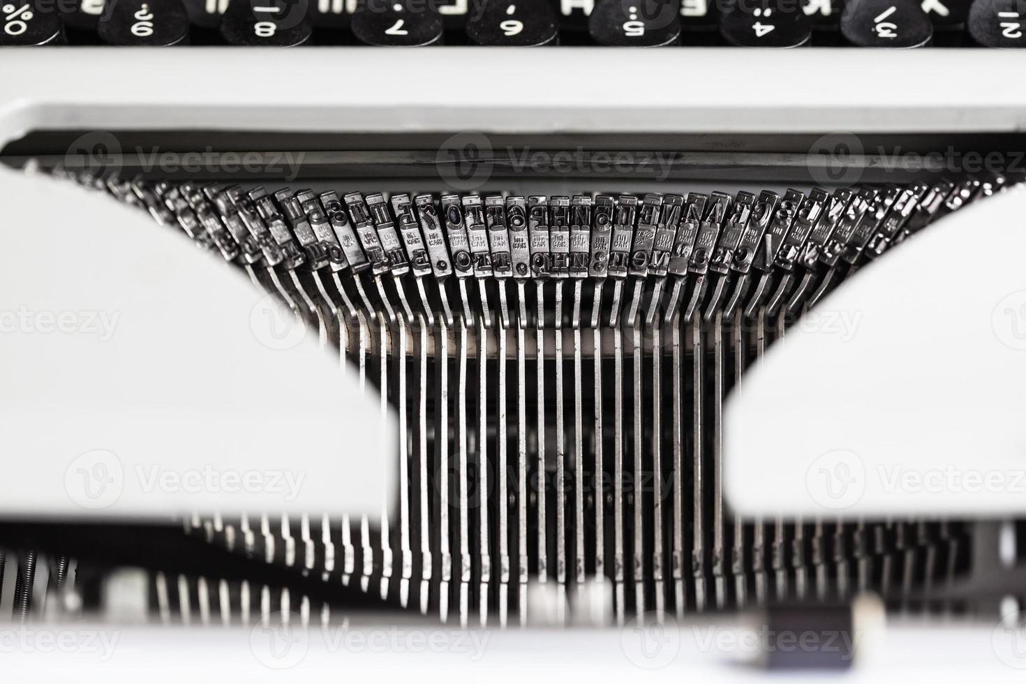 typebars with letter characters in old typewriter photo