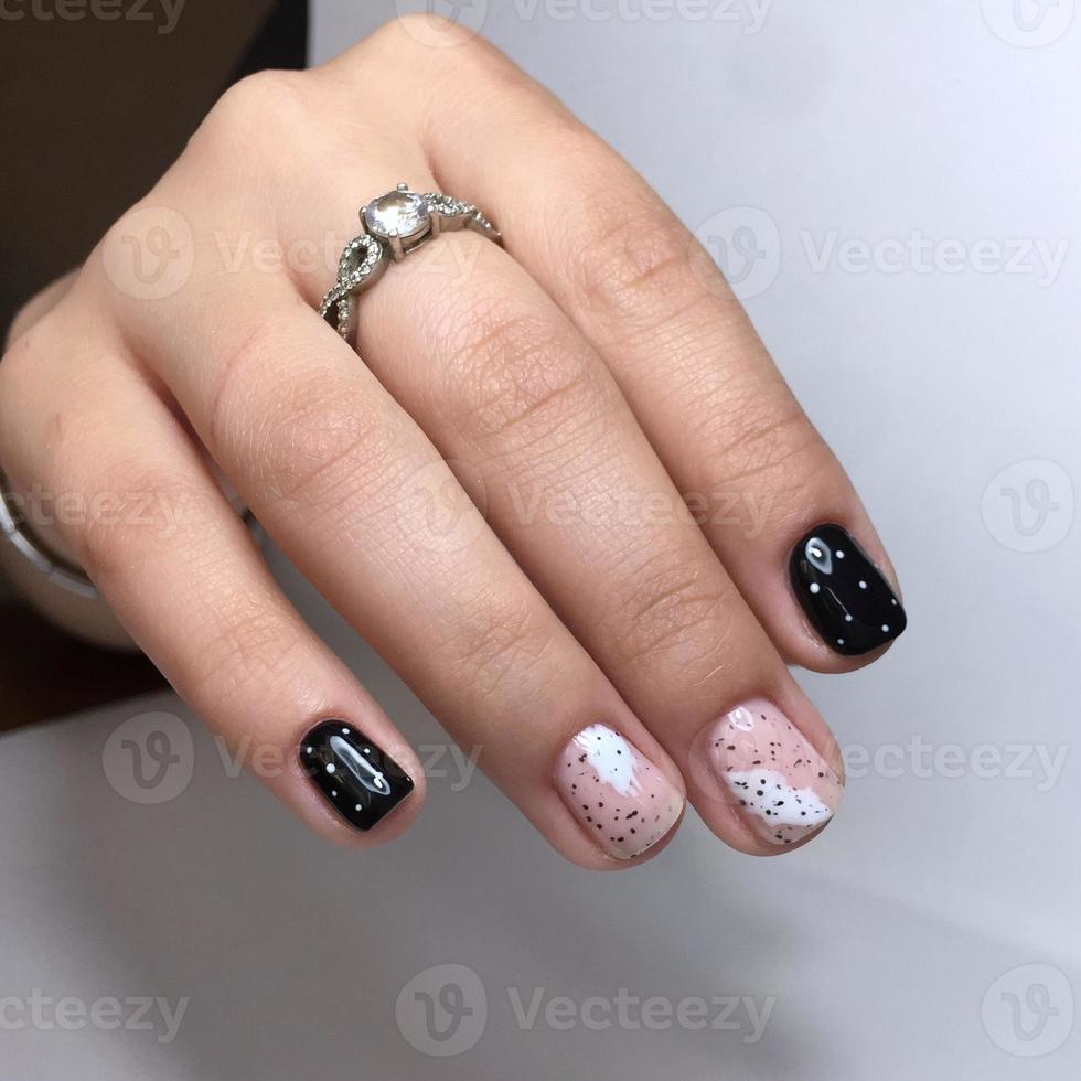 Manicure of different colors on nails. Female manicure on the hand photo