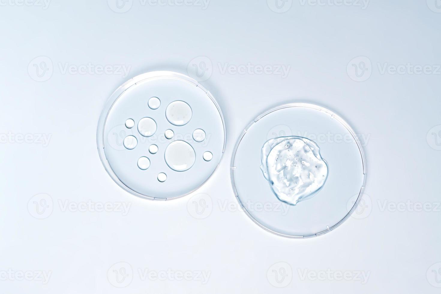 Cosmetic laboratory concept . Glass petri dish with cosmetic products on blue background. Flat lay image. photo