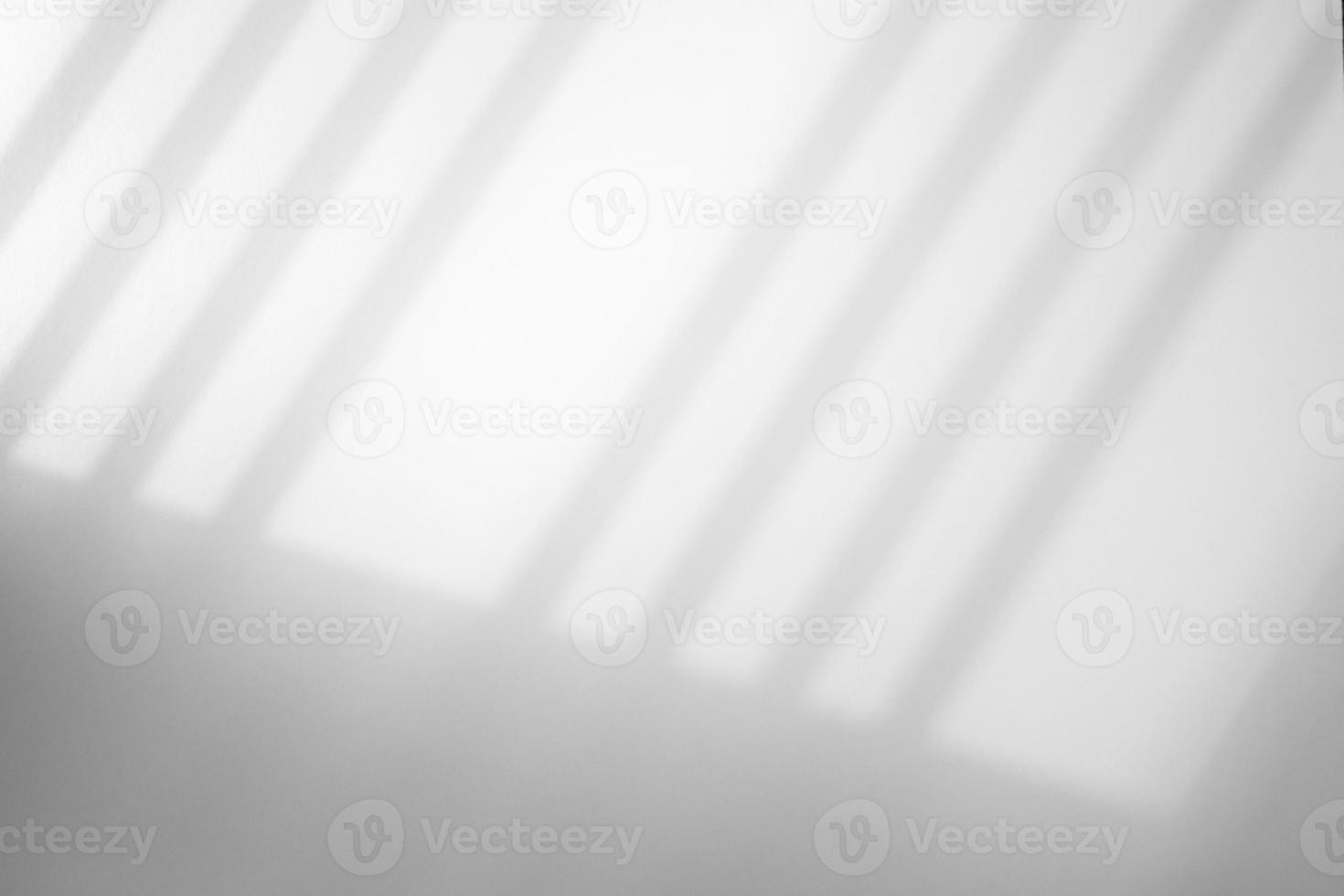 Window shadow drop on white wall background photo