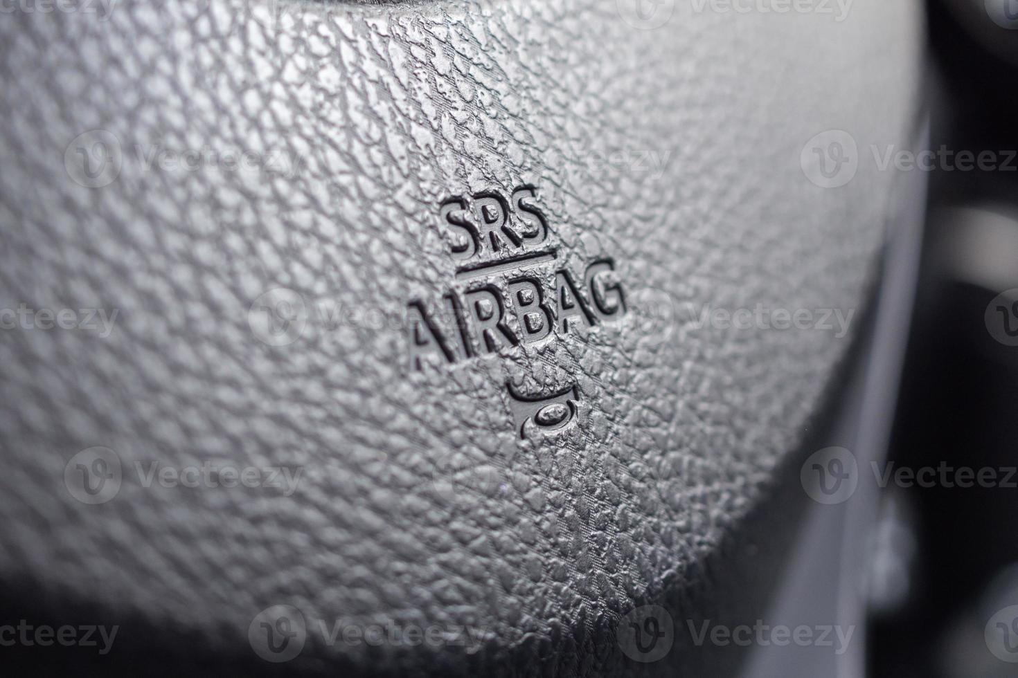 Safety airbag sign on car steering wheel with horn icon photo