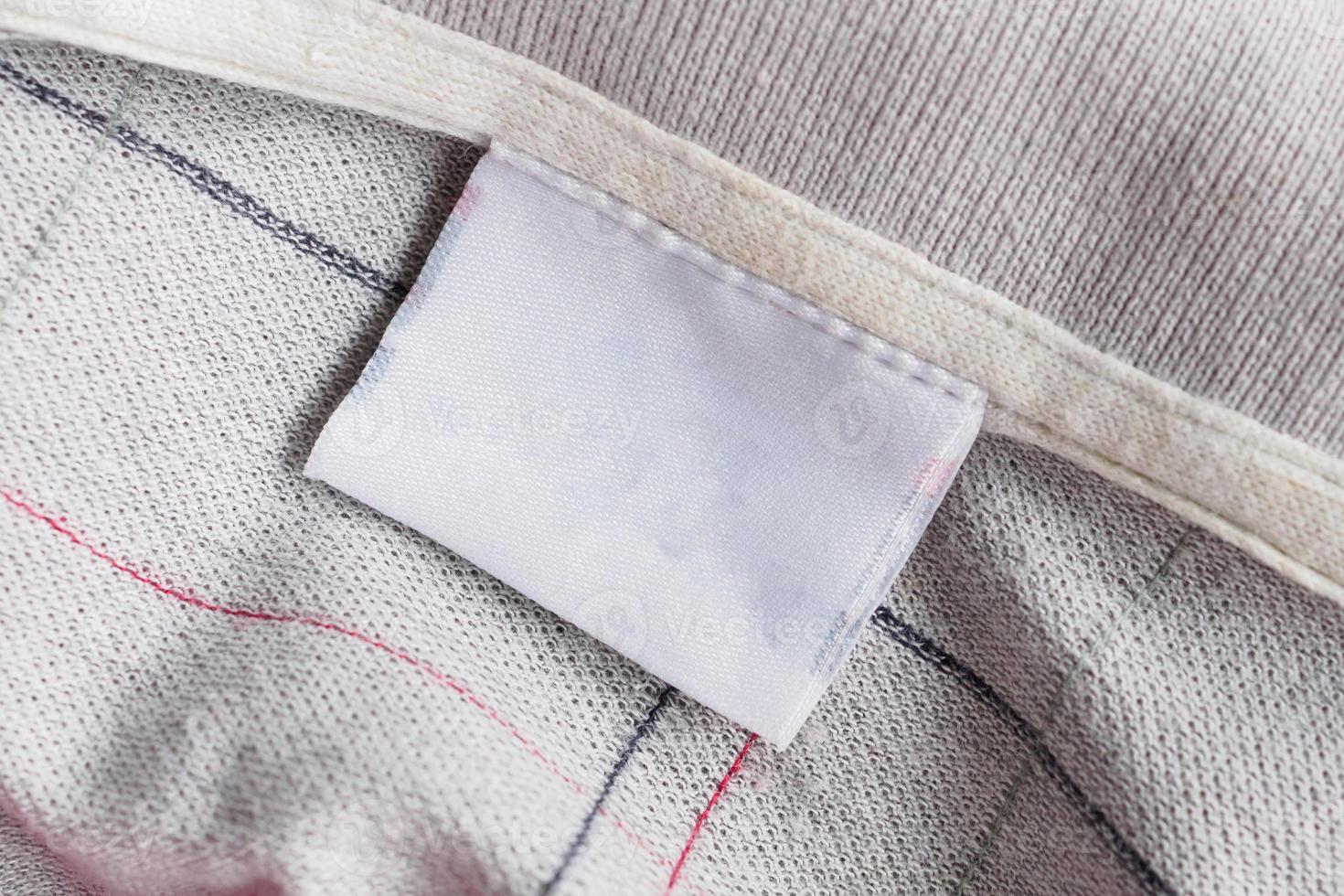 laundry care clothing label on fabric texture photo