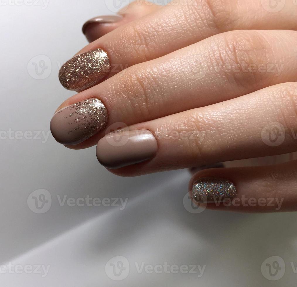 Manicure of different colors on nails. Female manicure on the hand photo