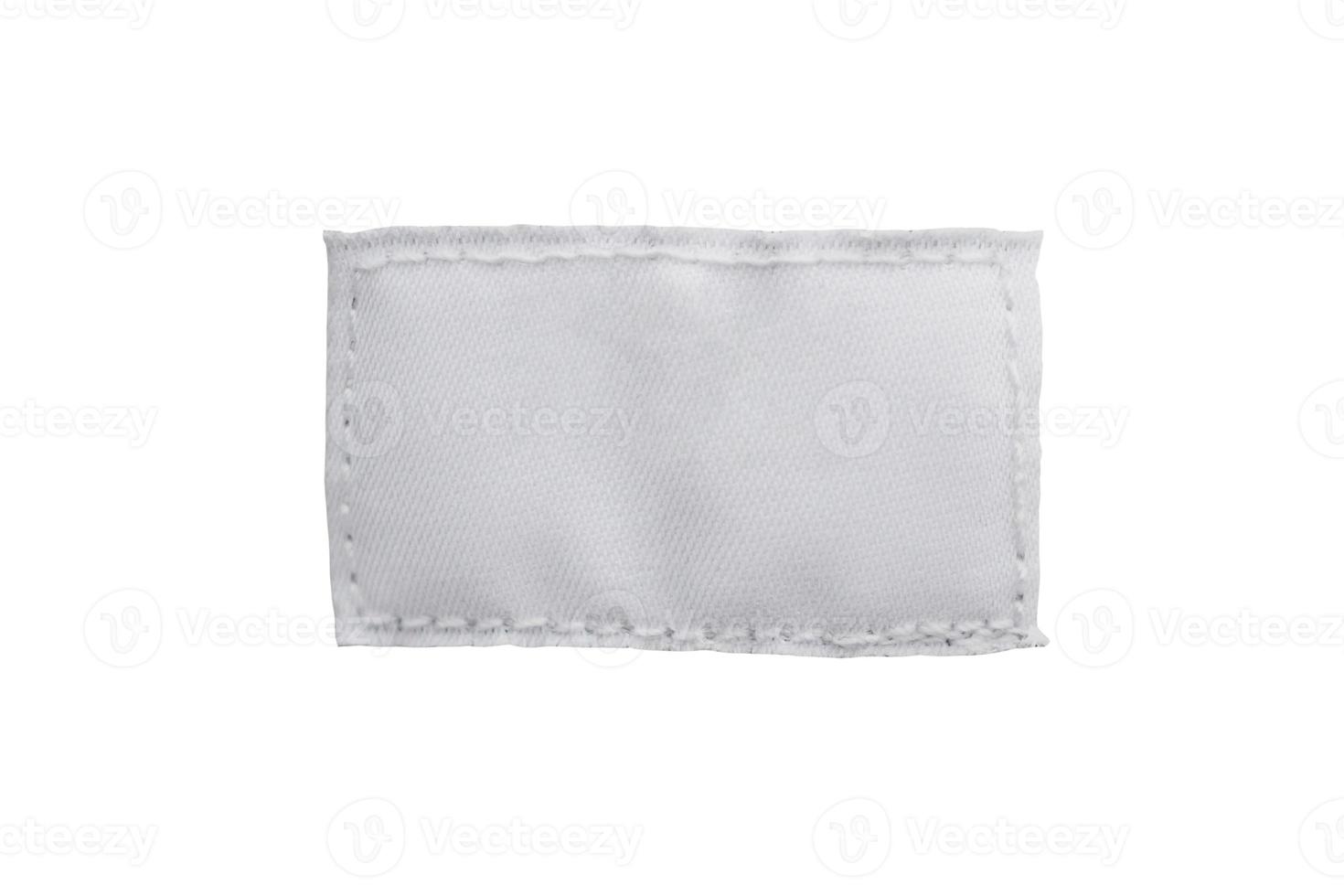blank textile clothing label isolated on white background photo