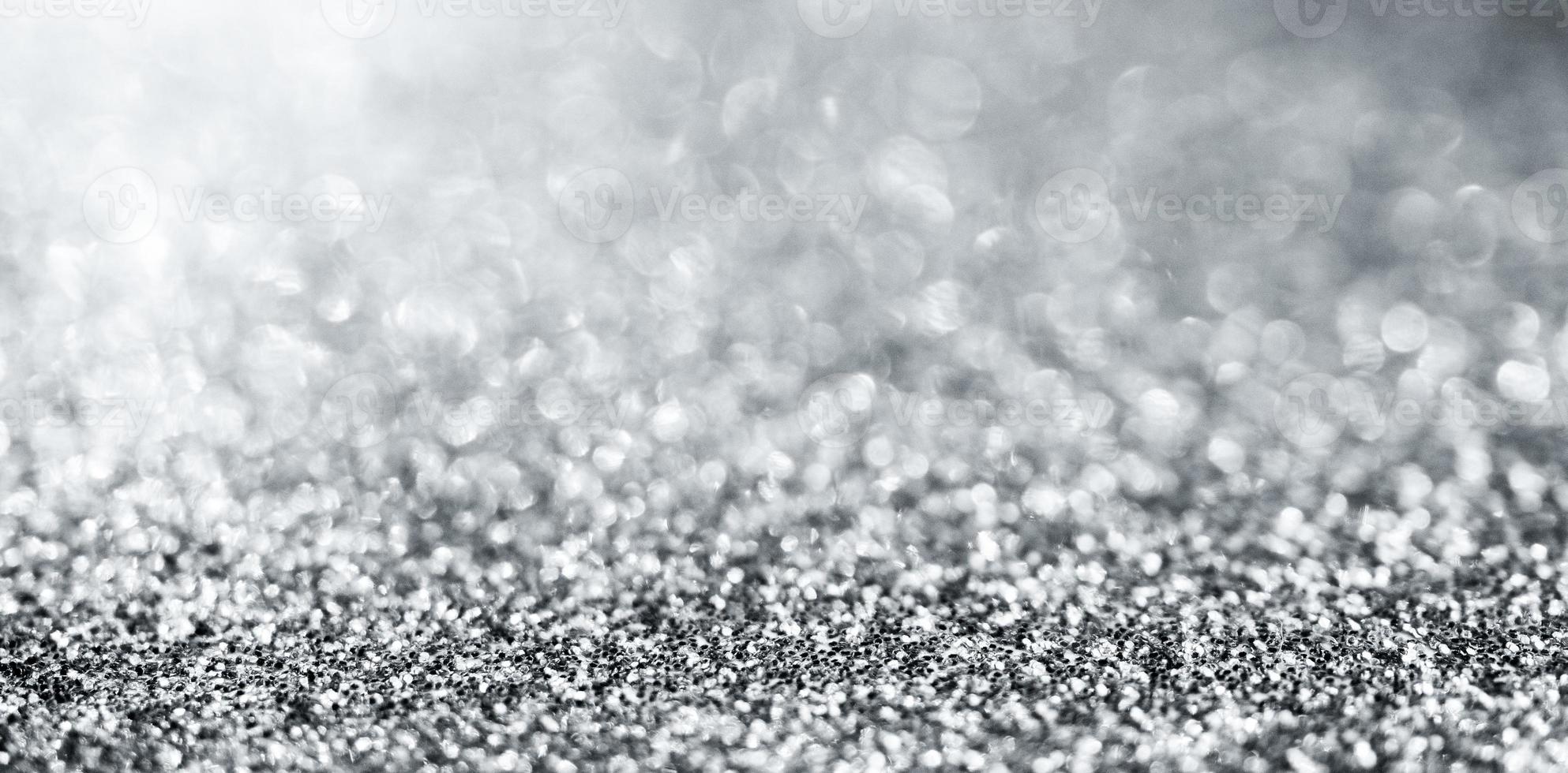 Abstract silver glitter sparkle texture with bokeh background photo