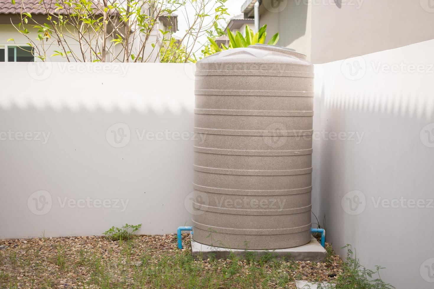 Water storage tank outside the house photo