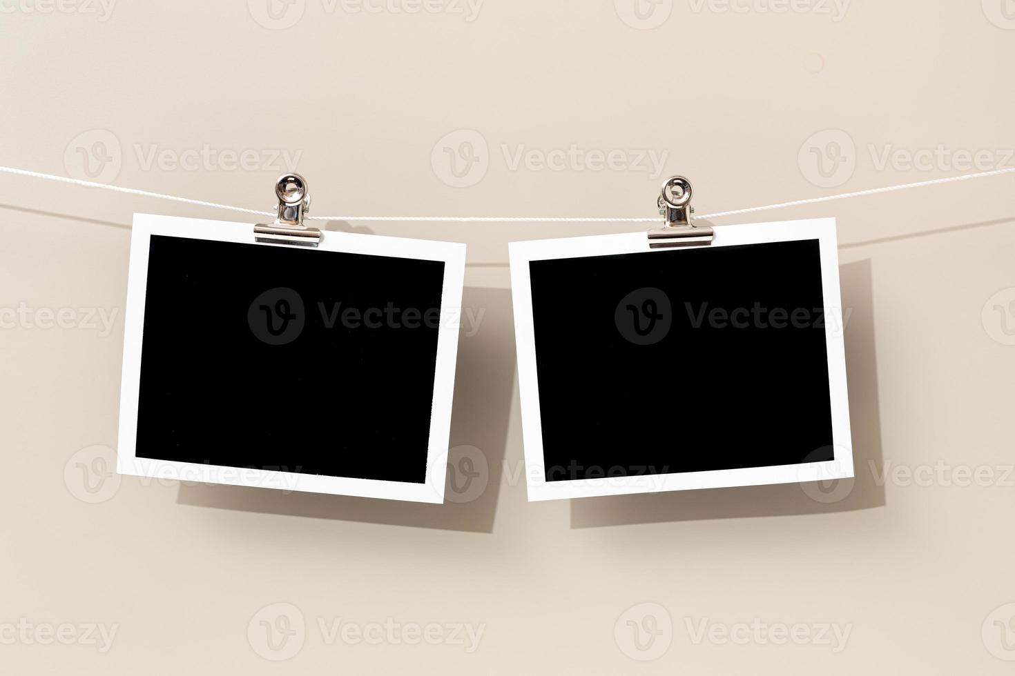 Two Blank Vintage instant photo frame hanging on a rope