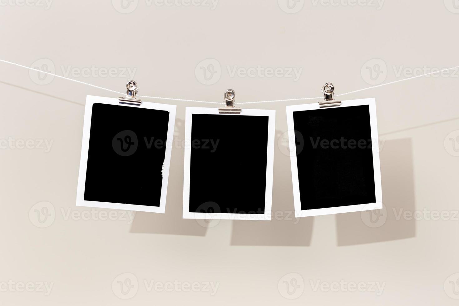 Three Blank Vintage instant photo frame hanging on a rope. Template