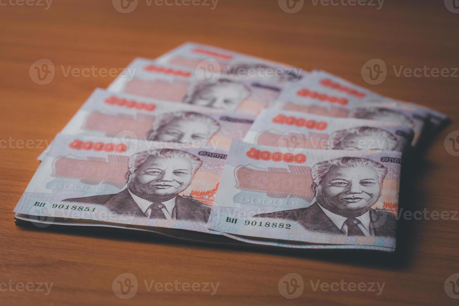 Closeup of lao kip curency on the table, inflation and economic concept photo