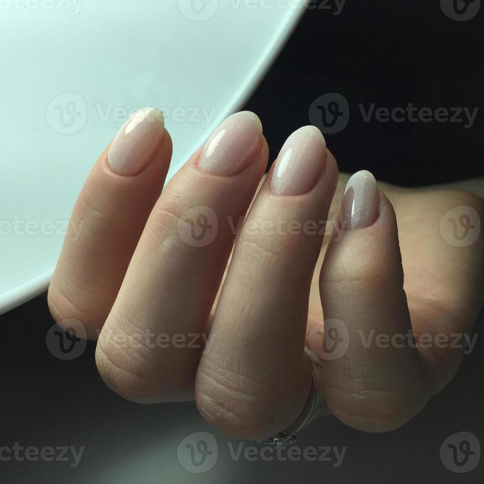 French manicure on the nails. French manicure design. Manicure gel nail polish photo