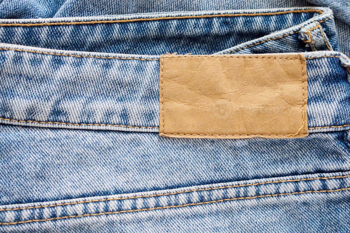 Blue denim jeans leather label texture background photo