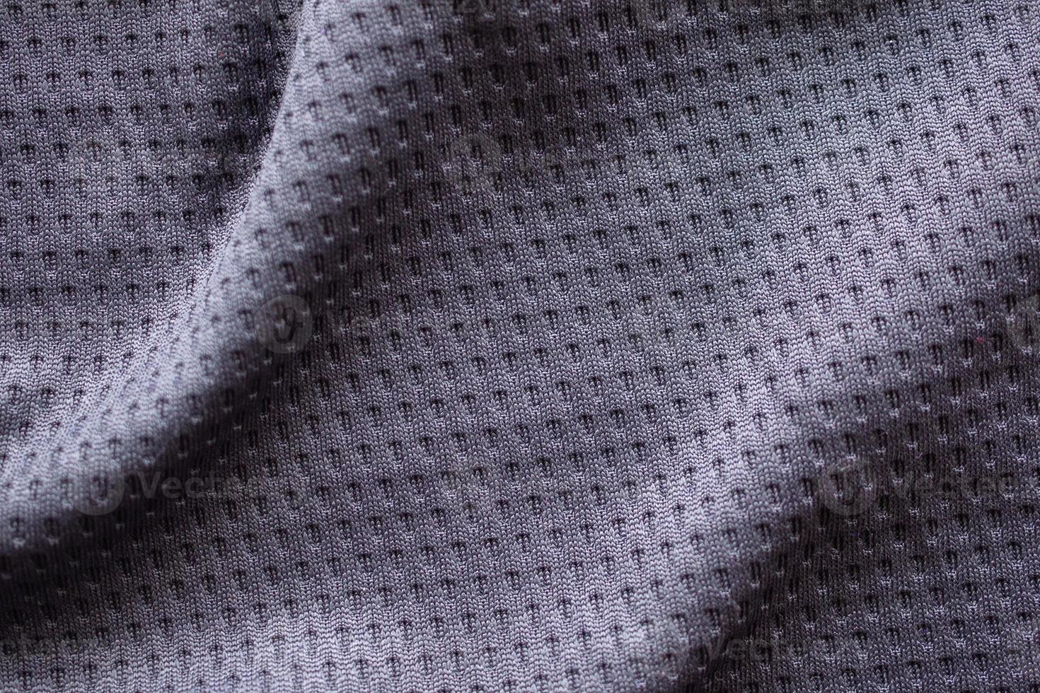 Gray fabric sport clothing football jersey with air mesh texture background photo